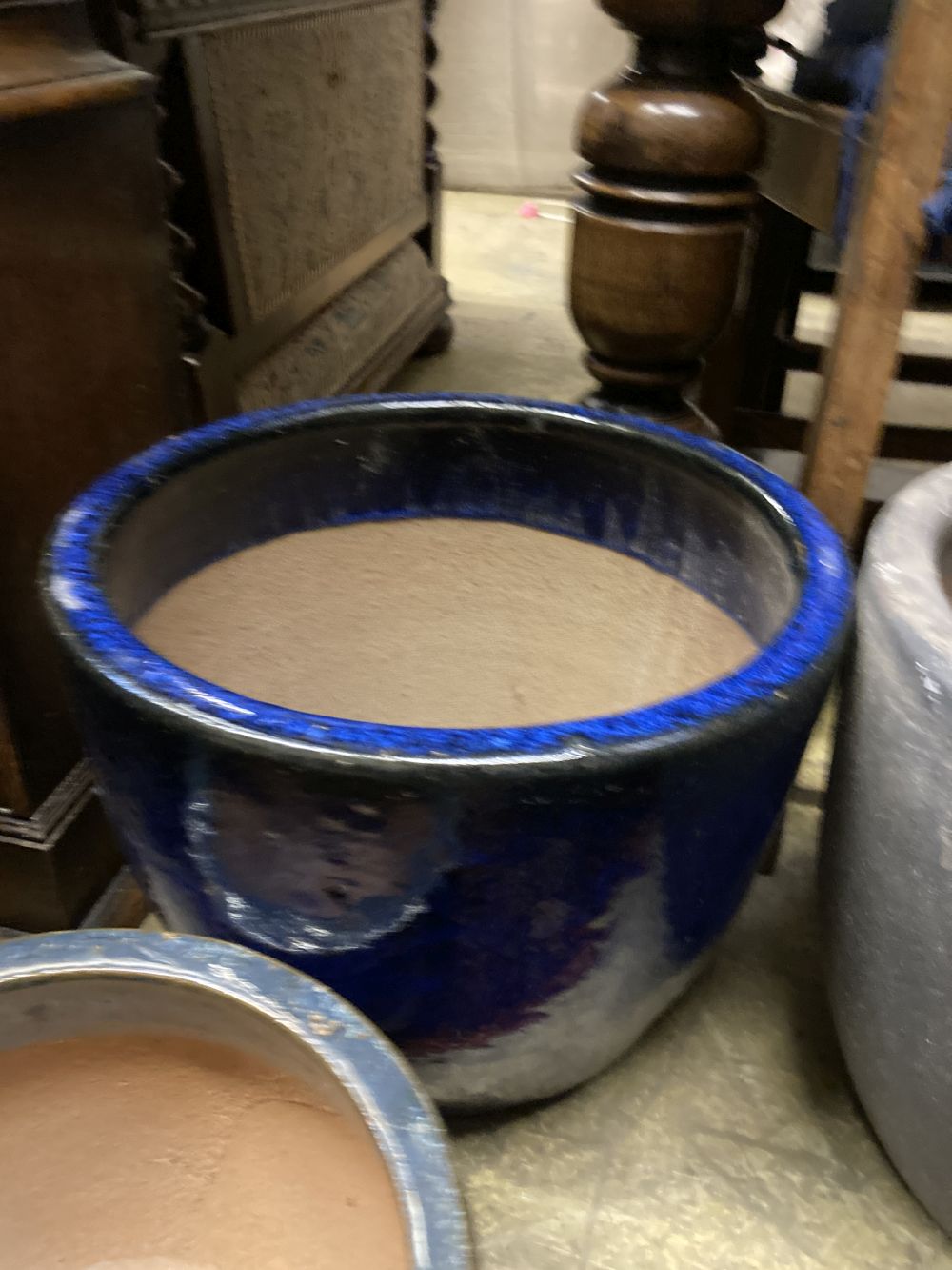 Four glazed earthenware garden planters, largest diameter 37cm